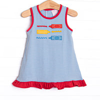 This dress features a blue striped print, ruffle trim, and multicolored crayon applique.