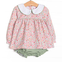  This set features a floral print, a peter pan collar, and a green polka dot diaper cover to match. 