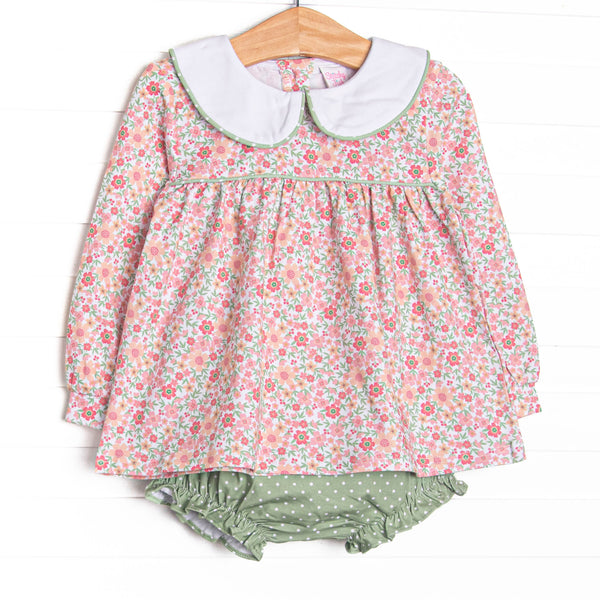  This set features a floral print, a peter pan collar, and a green polka dot diaper cover to match. 