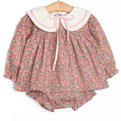  This set features a pink floral print, a cream collar, and a satin bow. Coordinating diaper cover to match. 