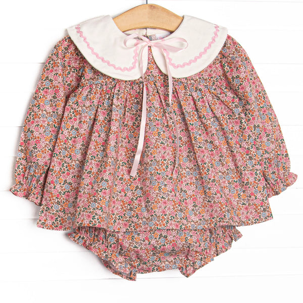  This set features a pink floral print, a cream collar, and a satin bow. Coordinating diaper cover to match. 