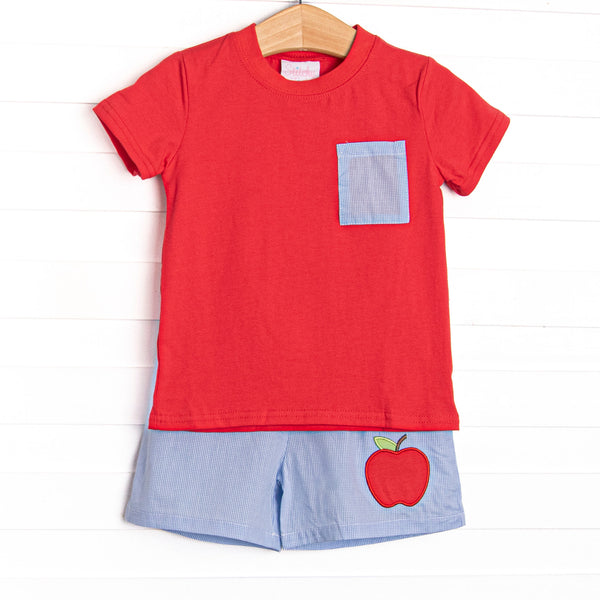  This set features a red top with a blue mini gingham pocket and blue mini gingham shorts with an apple applique to match. 