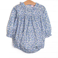 This bubble features a blue floral print, snaps on the stride, and ruffles collar. 
