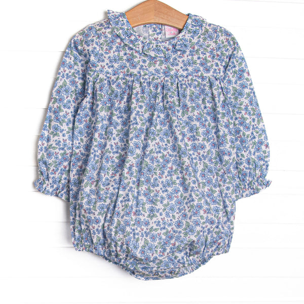  This bubble features a blue floral print, snaps on the stride, and ruffles collar. 