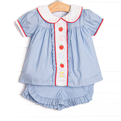 This set features blue gingham material, puff sleeves, and abc and apple embroidery.