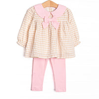  This set features a tan gingham print, a pink collar with bow, and pink leggings to match. 