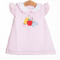  It features pink seersucker material with school details applique, flutter sleeves, and a ruffle seersucker trimmed collar. 