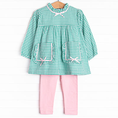 This set features a green gingham print, a pink satin bow trim, and front pockets. Coordinating pink leggings to match.