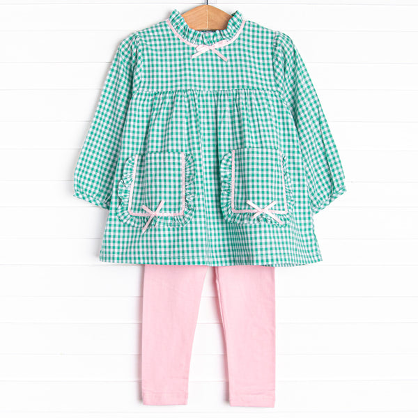 This set features a green gingham print, a pink satin bow trim, and front pockets. Coordinating pink leggings to match.