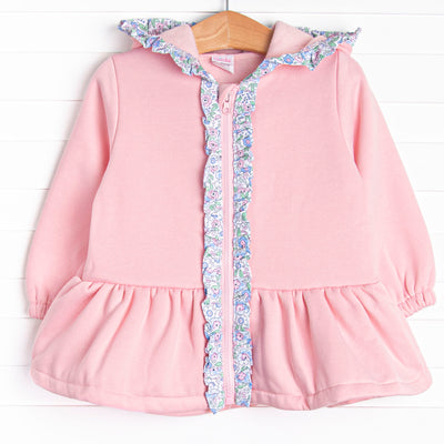 This jacket features the softest pink fleece material, a cozy hoodie, and floral ruffle trim.