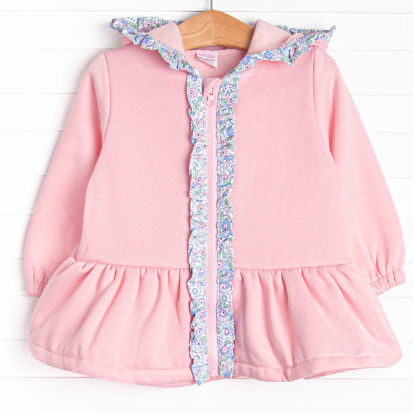 This jacket features the softest pink fleece material, a cozy hoodie, and floral ruffle trim.