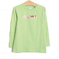  This top features light green fabric, long sleeves, and farm animal embroideries. 
