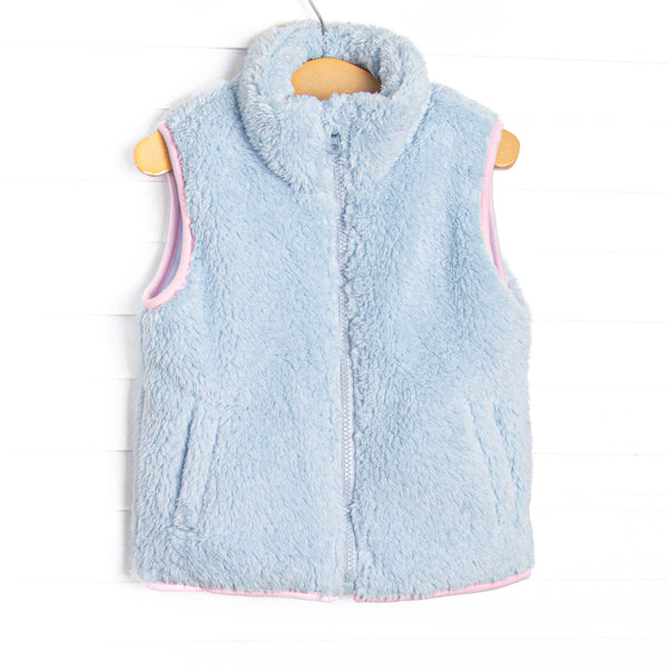  This vest features the softest blue fuzzy fleece, pockets to keep little hands warm, and a full zipper down the front. 