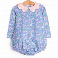  This bubble features a purple floral print, a pink scalloped collar, and the softest knit material. 
