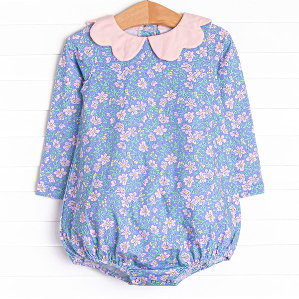  This bubble features a purple floral print, a pink scalloped collar, and the softest knit material. 