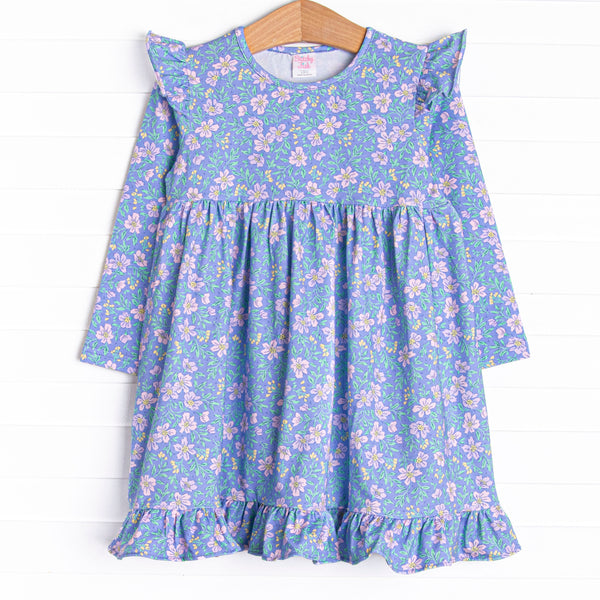 This dress features a purple floral print, ruffle trim, and the softest knit material.