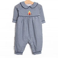  This romper features a navy blue gingham print, a peter pan collar, and a camp inspired applique. 