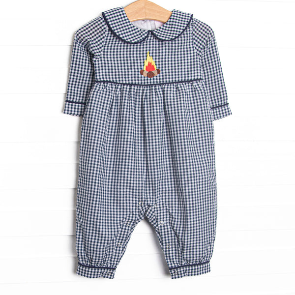  This romper features a navy blue gingham print, a peter pan collar, and a camp inspired applique. 