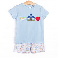  This set features a blue shirt with school appliques including books, a schoolhouse, and an apple. Coordinating patterned shorts to match. 
