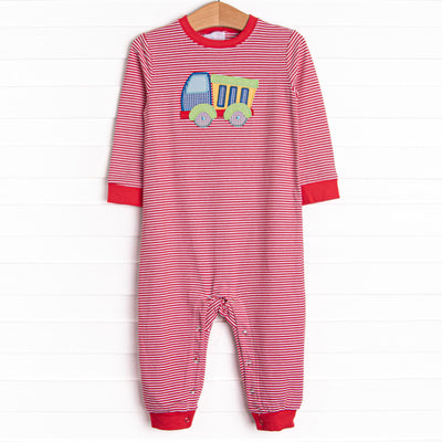  This romper features a red striped print, snaps on the stride, and a dump truck applique. 