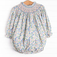  This bubble&nbsp; features a pink floral print, snaps on the stride, and the sweetest smocking. 