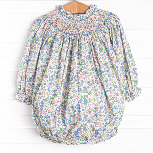  This bubble&nbsp; features a pink floral print, snaps on the stride, and the sweetest smocking. 