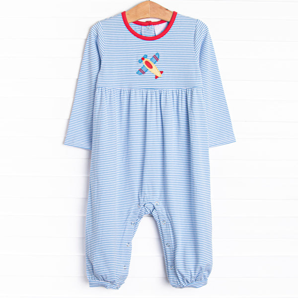 This romper features blue striped print, red trim, and an airplane applique.