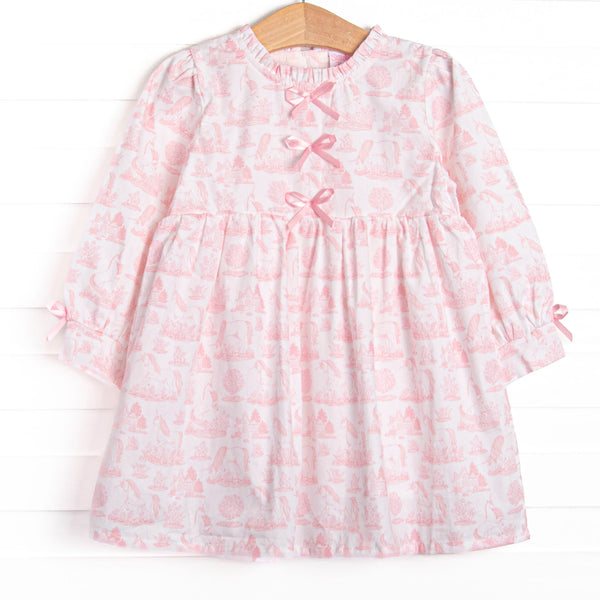 This dress features a pink dainty unicorn print, a trio of pink satin bows, and ruffle trim
