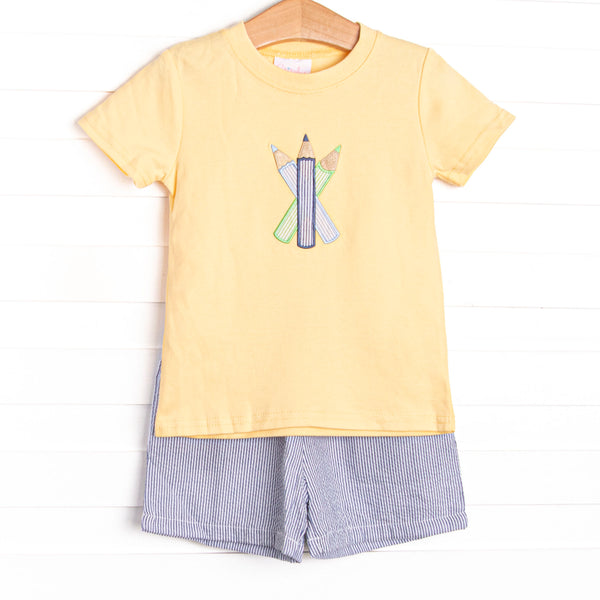 This set features a&nbsp; yellow short sleeve top with a colored pencils&nbsp; applique. Coordinating navy seersucker shorts to match.