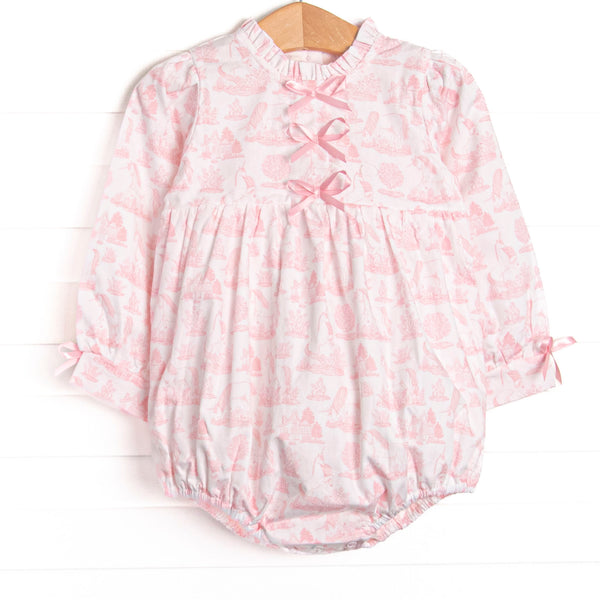 This bubble features a pink dainty unicorn print, a trio of pink satin bows, and ruffle trim.