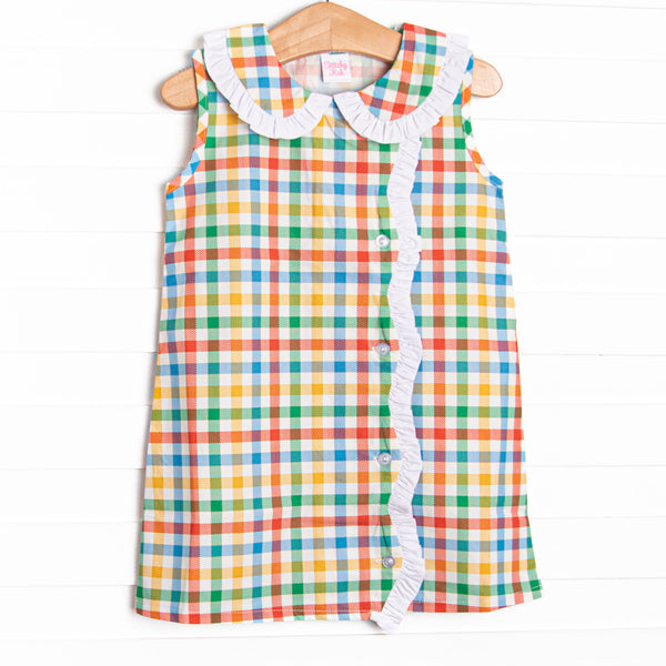 This dress features a plaid print, a peter pan collar, and white ruffle trim.