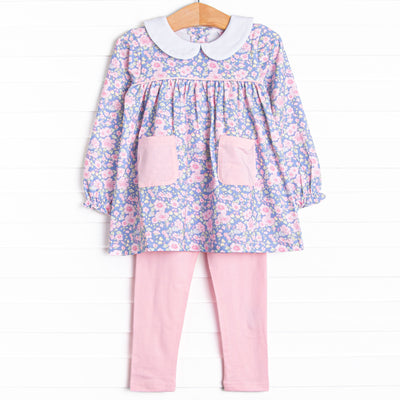This set features a purple floral top with a peter pan collar and pink front pockets. Coordinating pink leggings to match.