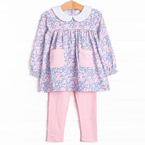 This set features a purple floral top with a peter pan collar and pink front pockets. Coordinating pink leggings to match.