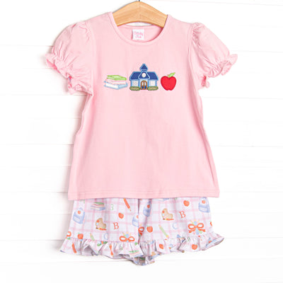  This set features a pink puff sleeve shirt with school appliques including books, a schoolhouse, and an apple. Coordinating school patterned ruffle shorts to match. 