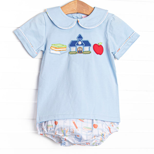 This set features a blue shirt with school appliques including books, a schoolhouse, and an apple. Coordinating school patterned diaper cover to match.