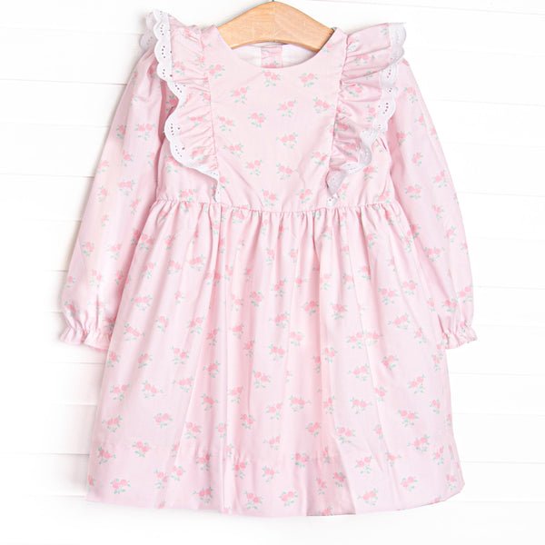 This dress features a rose print, ruffle shoulder details, and eyelet lace.