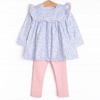  This set features a blue floral print, a ruffle bib with pink trim, and pink leggings to match. 