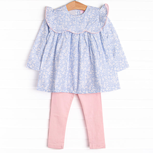  This set features a blue floral print, a ruffle bib with pink trim, and pink leggings to match. 