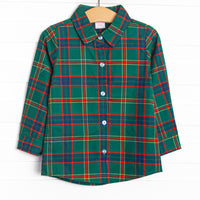 This shirt features a tartan plaid print, a collar, and front buttons.