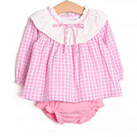 This set features a pink windowpane print top with a ruffle collar, and pink diaper cover to match.