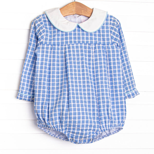  This bubble features a blue windowpane print, a peter pan collar, and snaps. 
