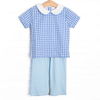  This set features a blue windowpane print top with a peter pan collar, and blue pants to match. 