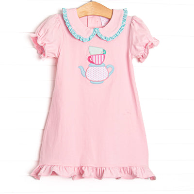 This dress features puff sleeves, a peter pan collar with mint striped ruffles, and a tea applique.