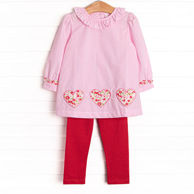  This set features a pink mini gingham print, a ruffle collar, and floral heart appliques. Coordinating red leggings to match. 