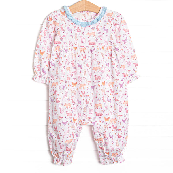 This romper features a farm animal print, a blue ruffle collar, and long sleeves. 