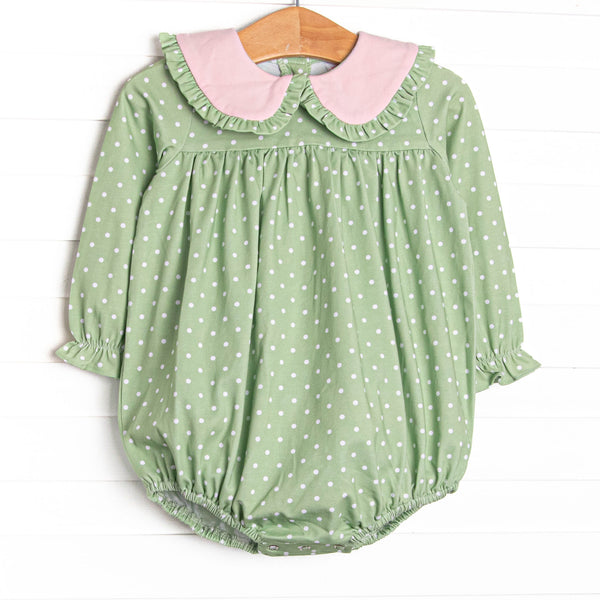  This bubble features a green polka dot print, pink ruffle trim, and snaps on the stride to make changing a breeze. 
