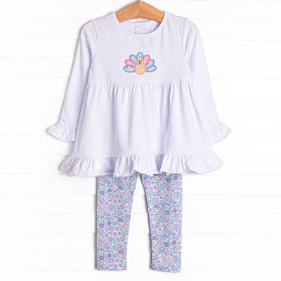 This set features a long sleeve top with a turkey applique and blue floral print leggings to match.