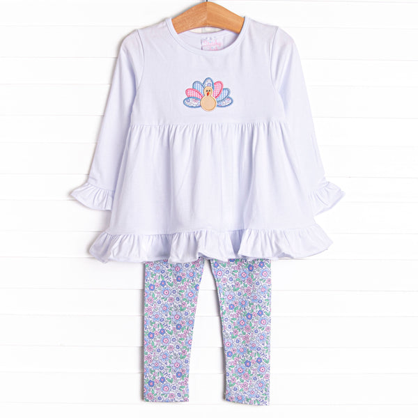 This set features a long sleeve top with a turkey applique and blue floral print leggings to match.