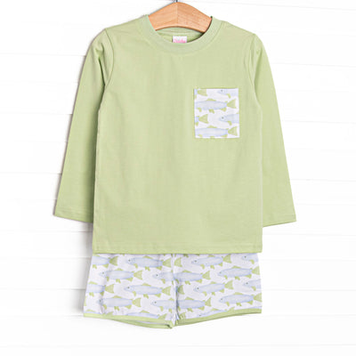 This set features a light green top with a fish print pocket and matching fish print shorts.