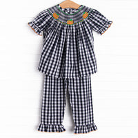  This set features a navy check print, puff sleeves, and pumpkin smockings. 